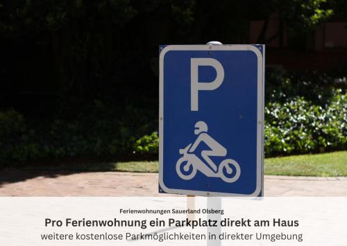a blue sign with a person riding a bike at Ferienwohnungen Sauerland und Olsberg in Olsberg