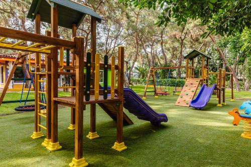 a park with a playground with slides and swings at Fun & Sun Club Saphire in Tekirova