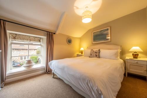 Voodi või voodid majutusasutuse Carpenters Cottage toas