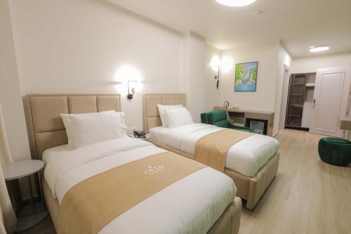 Postel nebo postele na pokoji v ubytování Olia Residence