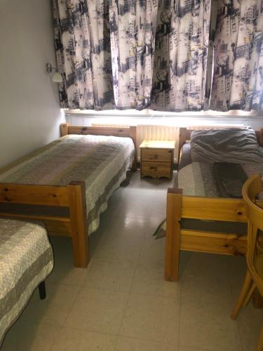 מיטה או מיטות בחדר ב-Guesthouse Langafit