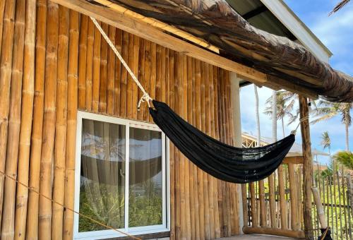 a hammock hanging from the side of a building at Villa Darroca Palawan in Araceli