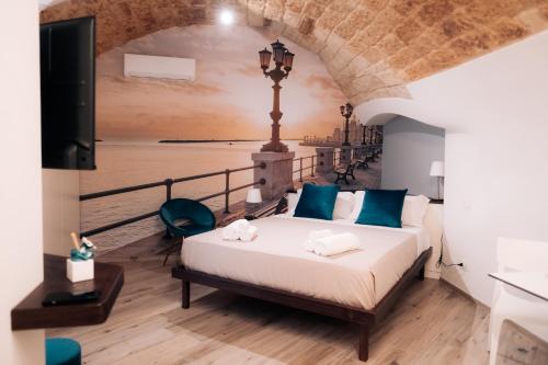 Ένα ή περισσότερα κρεβάτια σε δωμάτιο στο Timeless Apulian Luxury Suite