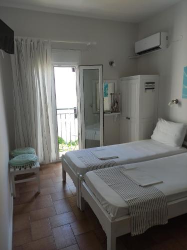 Posteľ alebo postele v izbe v ubytovaní Vetti Rooms