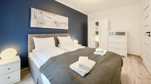 En eller flere senge i et værelse på Apartamenty Sun & Snow Baltic Residence