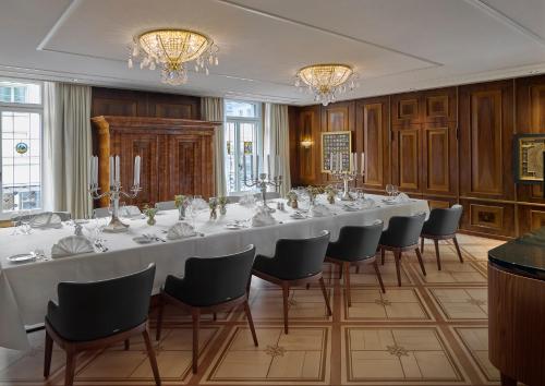 a large conference room with a long table and chairs at Mandarin Oriental Savoy, Zurich in Zürich