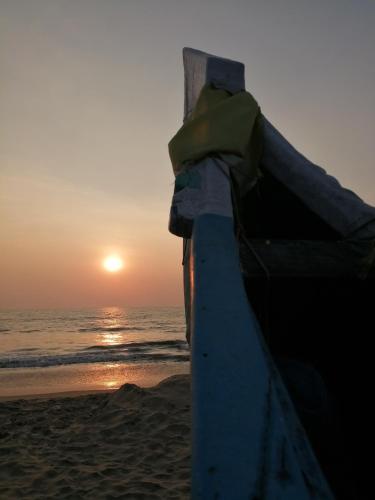 a view of the sunset from the beach at Ocean Whisper- psst! hidden gem in Kaipamangalam