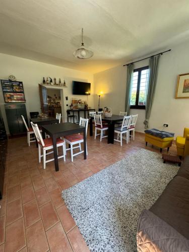 a living room with a table and chairs at Affittacamere Ca' de Mazapedar in San Lorenzo