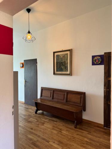 a room with a bed and a painting on the wall at Affittacamere Ca' de Mazapedar in San Lorenzo