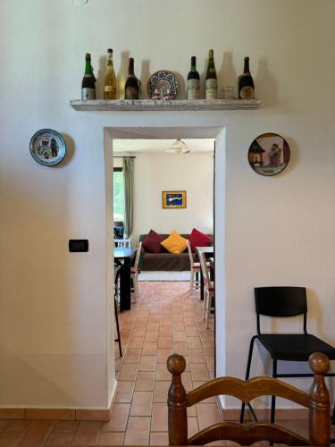 a hallway with a living room and a dining room at Affittacamere Ca' de Mazapedar in San Lorenzo
