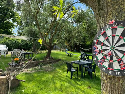 a dart board on a tree in a park at Affittacamere Ca' de Mazapedar in San Lorenzo