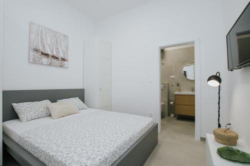 Ένα ή περισσότερα κρεβάτια σε δωμάτιο στο Apartmani Vrlika