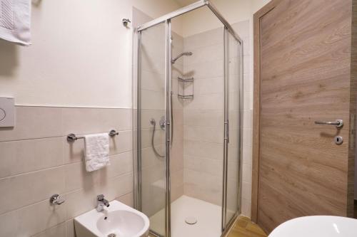 a bathroom with a shower and a sink at Cà Mandarein in Quattro Castella