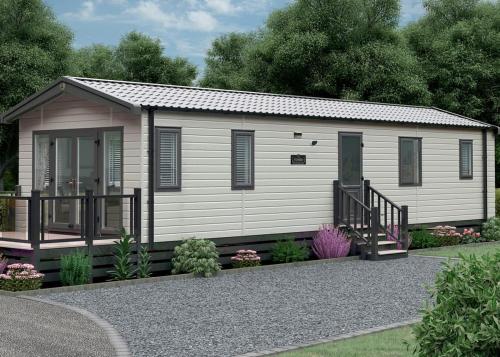 a small white shed with a porch at Aber Bay Holiday Park in Aberystwyth