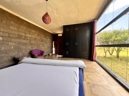Gallery image of Amboseli Glass house in Oloitokitok 