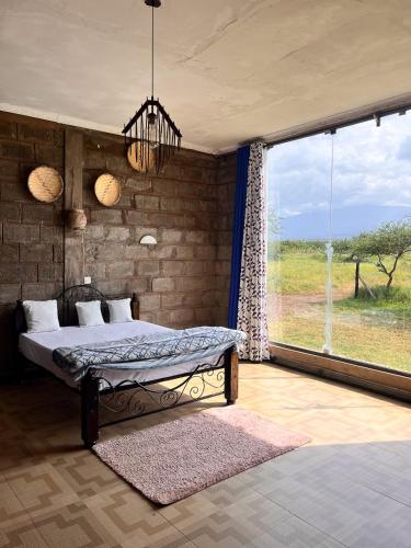 Gallery image of Amboseli Glass house in Oloitokitok 
