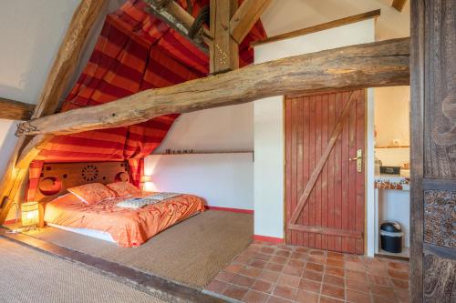 Ένα ή περισσότερα κρεβάτια σε δωμάτιο στο Bed and Bourgogne