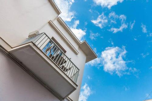 a balcony of a building with the sky in the background at Don Nicola Tourist Location in Polignano a Mare