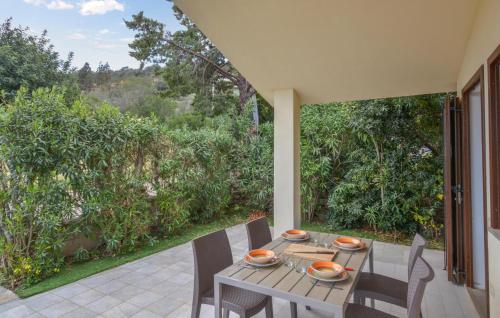 a table and chairs sitting on a patio at Secca 3 in Costa Rei