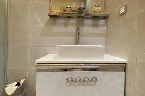 a bathroom with a sink and a toilet at Luxury 3 bedroom Apartment with a great Seaview* in Abū Qīr