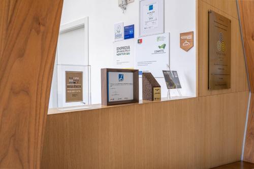 a display case with signs on a wall at Pena Park Hotel in Ribeira de Pena