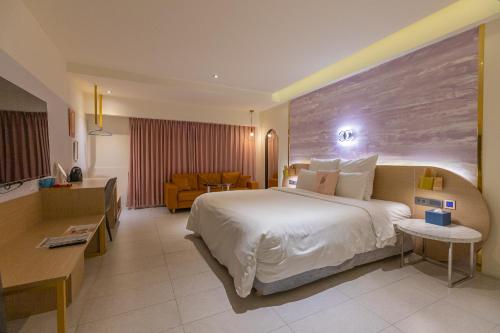 Postel nebo postele na pokoji v ubytování 里萊行旅 - Lilai Motel