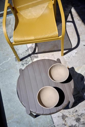 a chair and a chair with a table and a chair at Nami Suites - Alenia in Chania Town