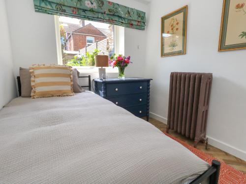 Postel nebo postele na pokoji v ubytování Chapelhay Cottage