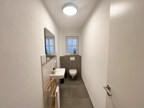 Ein Badezimmer in der Unterkunft LiBORIA I Als Gruppe am Riegsee