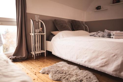Postel nebo postele na pokoji v ubytování Pfälzer Herzel