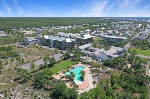 an aerial view of a home with a pool and resort at Embreeze Beach Casa by Pristine Properties Vacation Rentals in Highland View