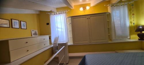 Postel nebo postele na pokoji v ubytování Sunset House a Zambrone