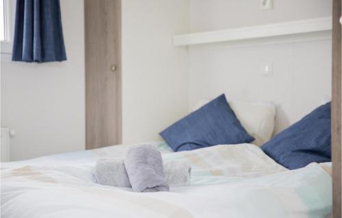 a pair of socks sitting on top of a bed at Cozy Home In Breukelen With Wifi in Breukelen