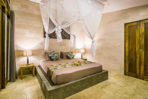 Melaya Estate by LifestyleRetreats tesisinde bir odada yatak veya yataklar