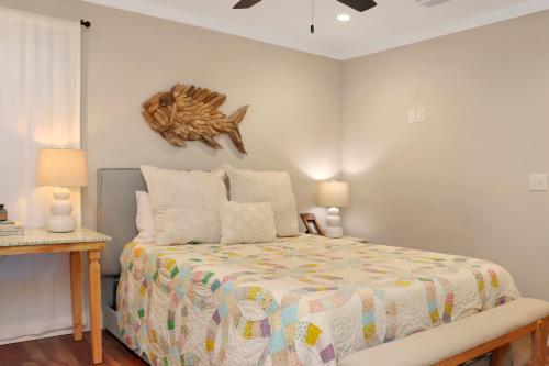a bedroom with a bed with a starfish on the wall at The Surf Ranch by Pristine Properties Vacation Rentals in Port Saint Joe