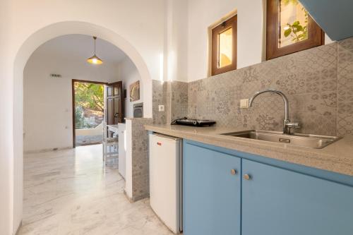 a kitchen with a sink and a counter at Ζini 2 in Kefalos