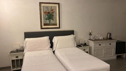 Ένα ή περισσότερα κρεβάτια σε δωμάτιο στο La Terrazza Vercelli Bed & Charme