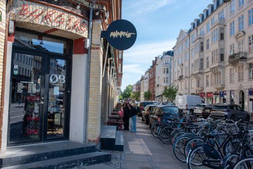a group of bikes parked in front of a store at NEW charming apt in City Center in Copenhagen