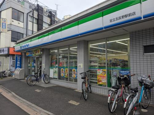 a group of bikes parked outside of a store at 7House in Tokyo