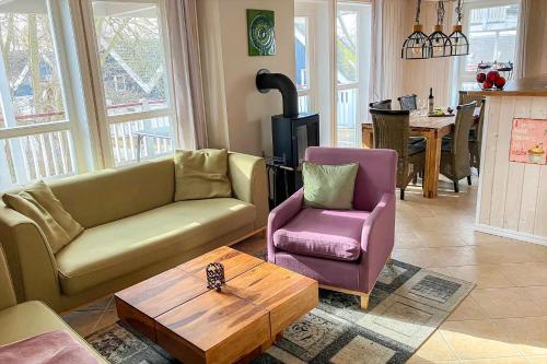 a living room with a couch and a chair and a table at Ferienpark Bad Saarow in Bad Saarow