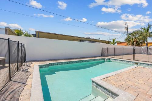 a swimming pool in the backyard of a house at Fortebello Beachside 170 With PRIVATE POOL in Indian Harbour Beach