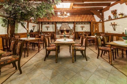 a dining room with wooden tables and chairs at Landhotel Zur Linde in Verden