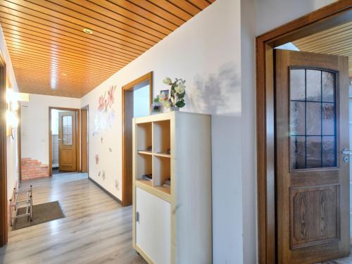 a hallway with a wooden ceiling and a door at Holiday Home Ferienhaus Born by Interhome in Schieder-Schwalenberg