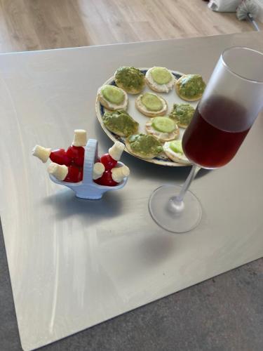 a table with a plate of food and a drink at LA PASSIFLORE in Azé
