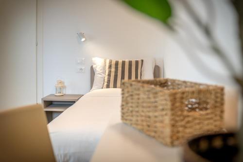 a bedroom with a bed with a bag on it at Barchessa Cappelletto in Torre di Mosto