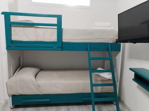 מיטה או מיטות קומותיים בחדר ב-giadaffittacamere
