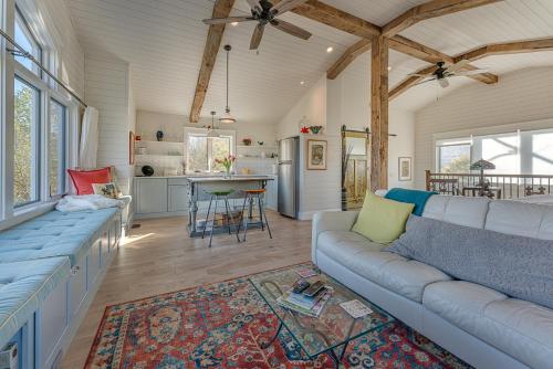 a living room with a couch and a kitchen at La Soledad Lavender Farm and Guesthouse in Harpers Ferry