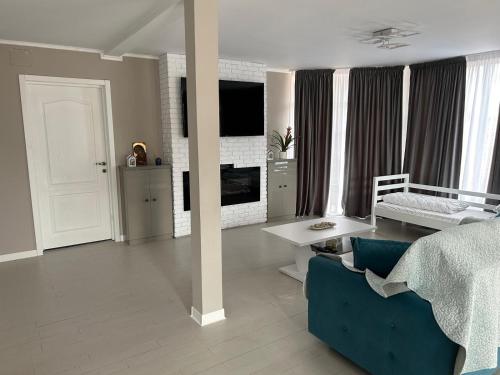 En eller flere senge i et værelse på Apartament Orizont