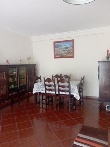 a dining room with a table and chairs at CASA SENHORA DA VEIGA in Vila Nova de Foz Coa