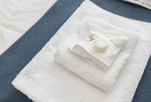 a white napkin with a candle on top of it at Ariel in Marcross